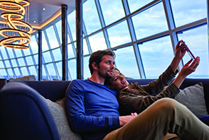 Couple on lounge area enjoying cruise